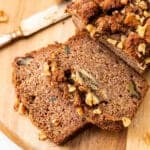 sliced almond flour banana bread on a wood cutting board