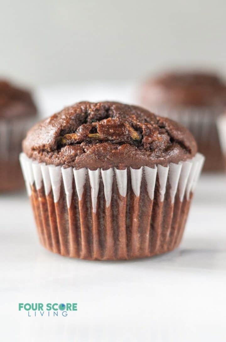 a chocolate muffin in a cupcake liner.