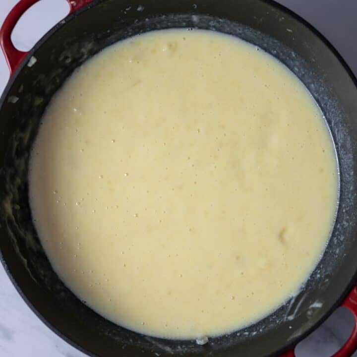 Stock pot filled with smooth potato soup.