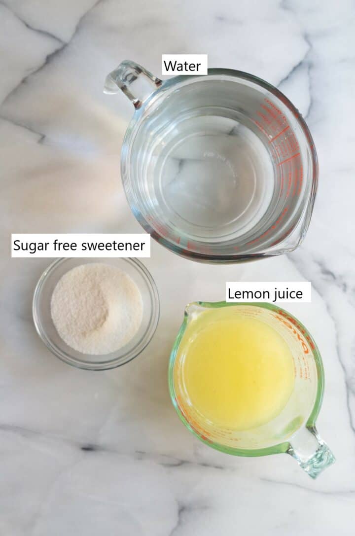 Ingredients for lemonade in separate measuring cups.