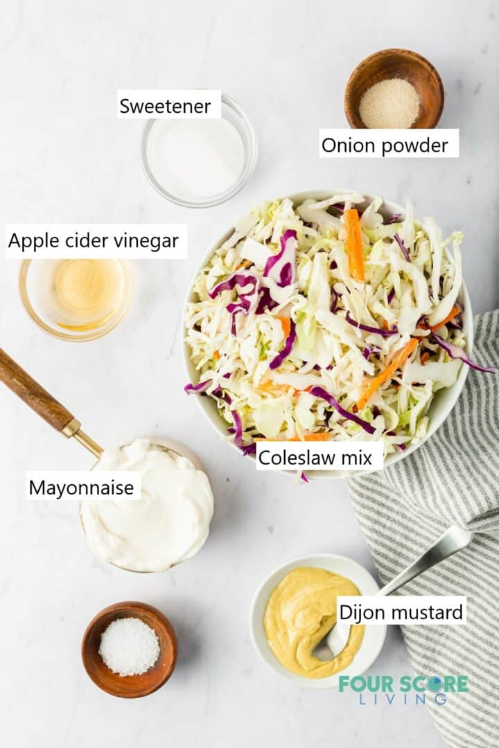 All of the ingredients to make keto coleslaw in individual bowls.