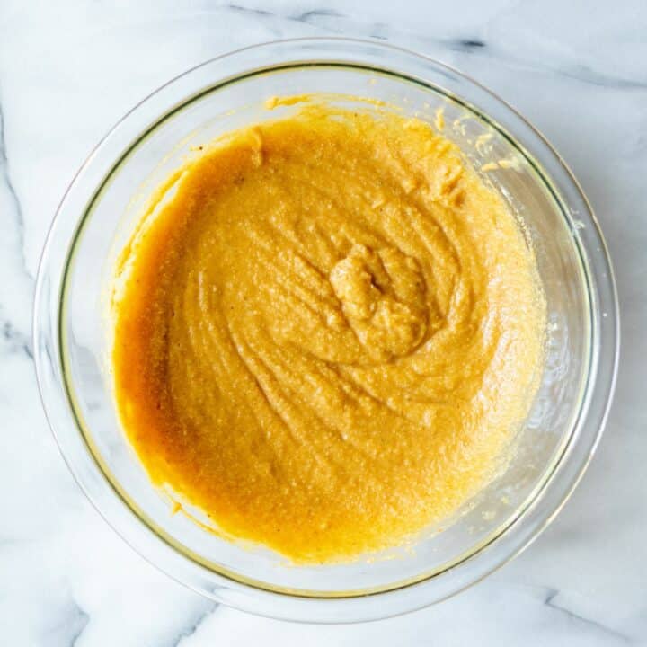 Keto pumpkin bars batter in a glass bowl.