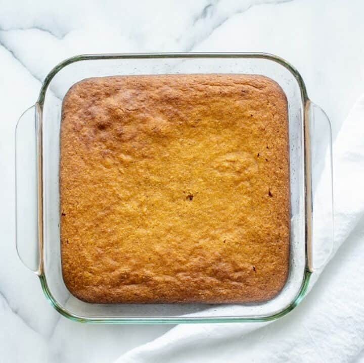 Glass baking dish with a fully baked low carb pumpkin bars recipe.