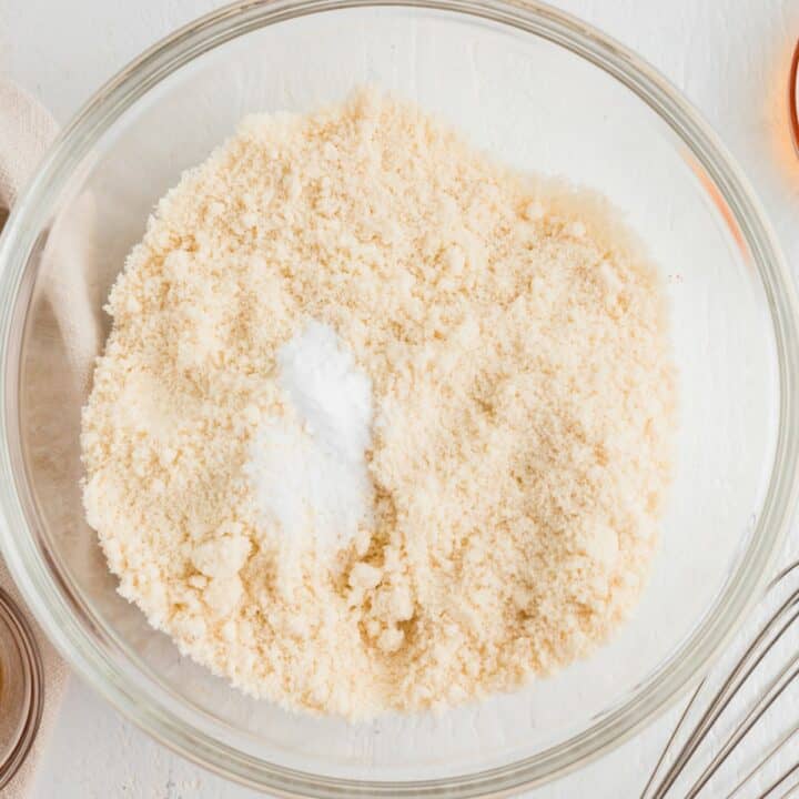 Glass bowl containing almond flour, salt and baking soda.