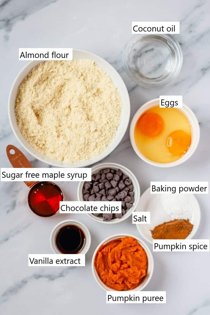 The ingredients for low carb pumpkin muffins in individual bowls.