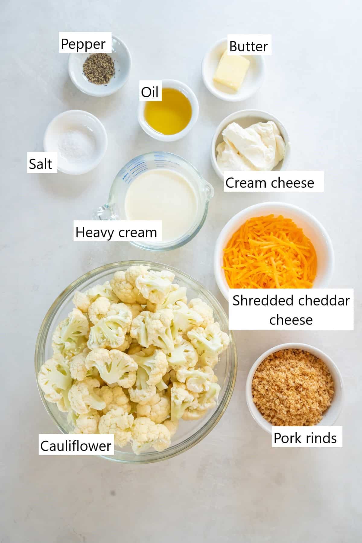 Ingredients for making keto cauliflower mac and cheese in individual bowls.