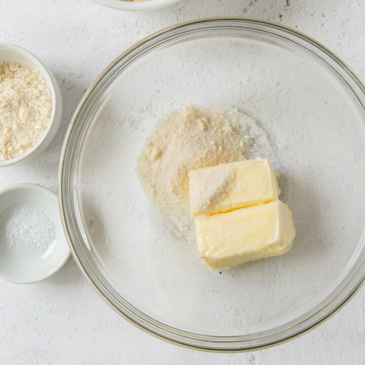 Glass bowl with butter and erythritol before it is mixed.