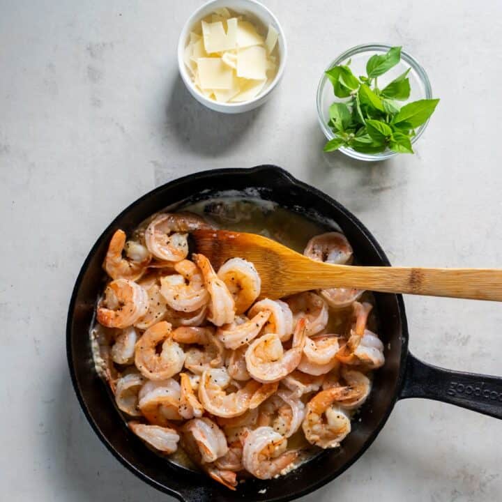 Shrimp have been added back to the skillet and cooked in the sauce.