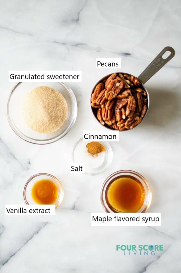 Ingredients for making keto candied pecans in individual bowls.