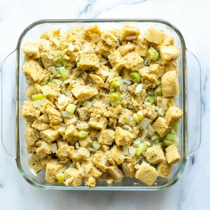 Glass baking dish filled with unbaked low carb stuffing mixture.