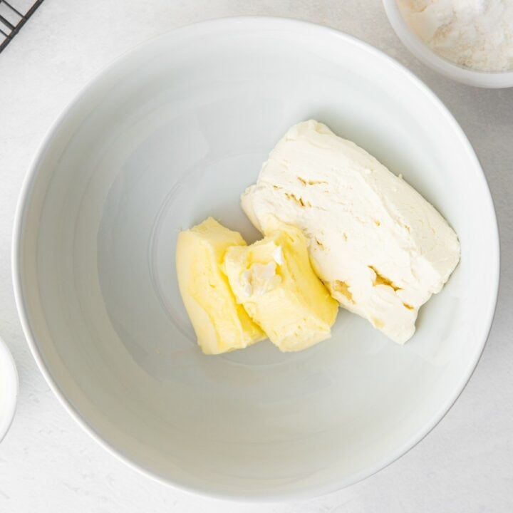 Bowl containing cream cheese and butter for making the frosting.