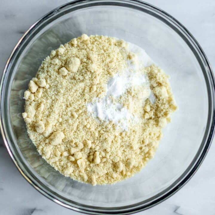 Glass bowl with the dry ingredients of almond flour, salt and baking soda.