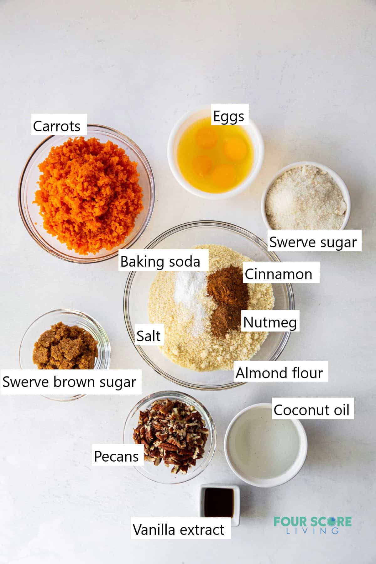 The ingredients needed for making a keto carrot cake in individual bowls.