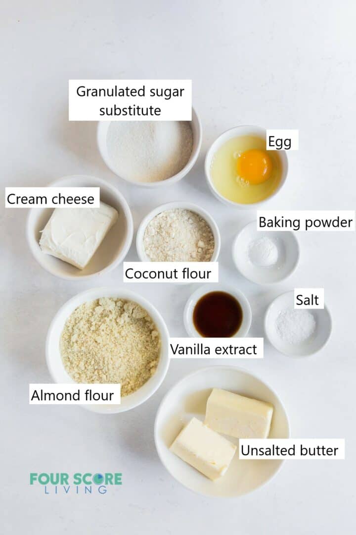 The ingredients needed for making keto cream cheese cookies all in individual bowls.