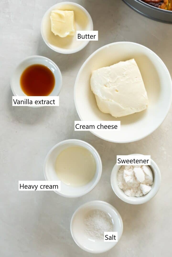 The ingredients needed to make keto cream cheese frosting, all measured into small bowls.