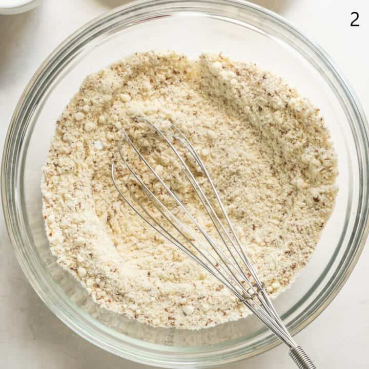 Glass bowl with the dry ingredients being whisked together.