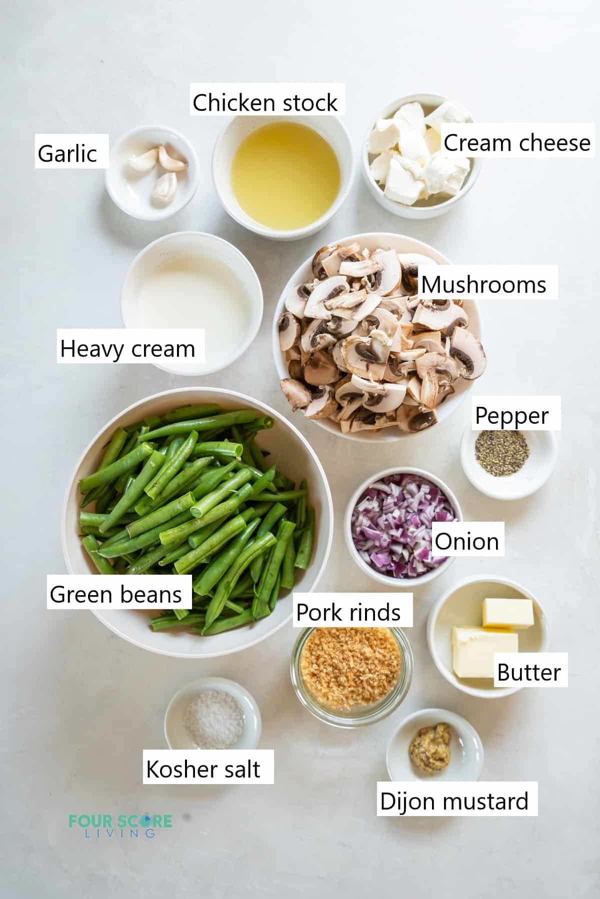 Ingredients needed to make a keto green bean casserole all in individual bowls.