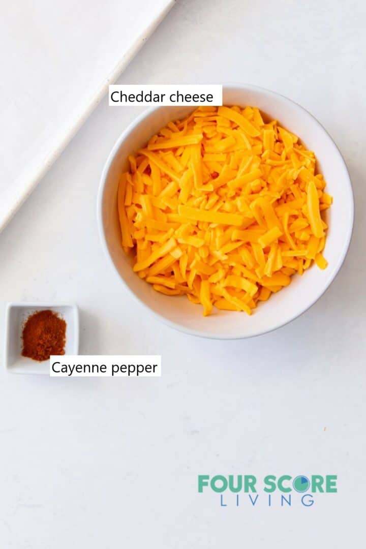 Ingredients needed to make keto cheese chips in individual bowls.